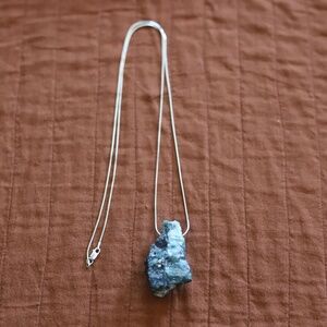 Raw emerald and mica semi precious stone/rock on long silver chain. NWT